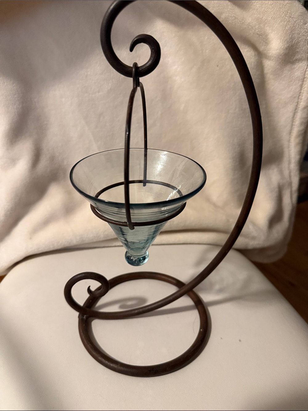 Hanging Glass Teardrop Bowl on Curved dark bronze iron stand.